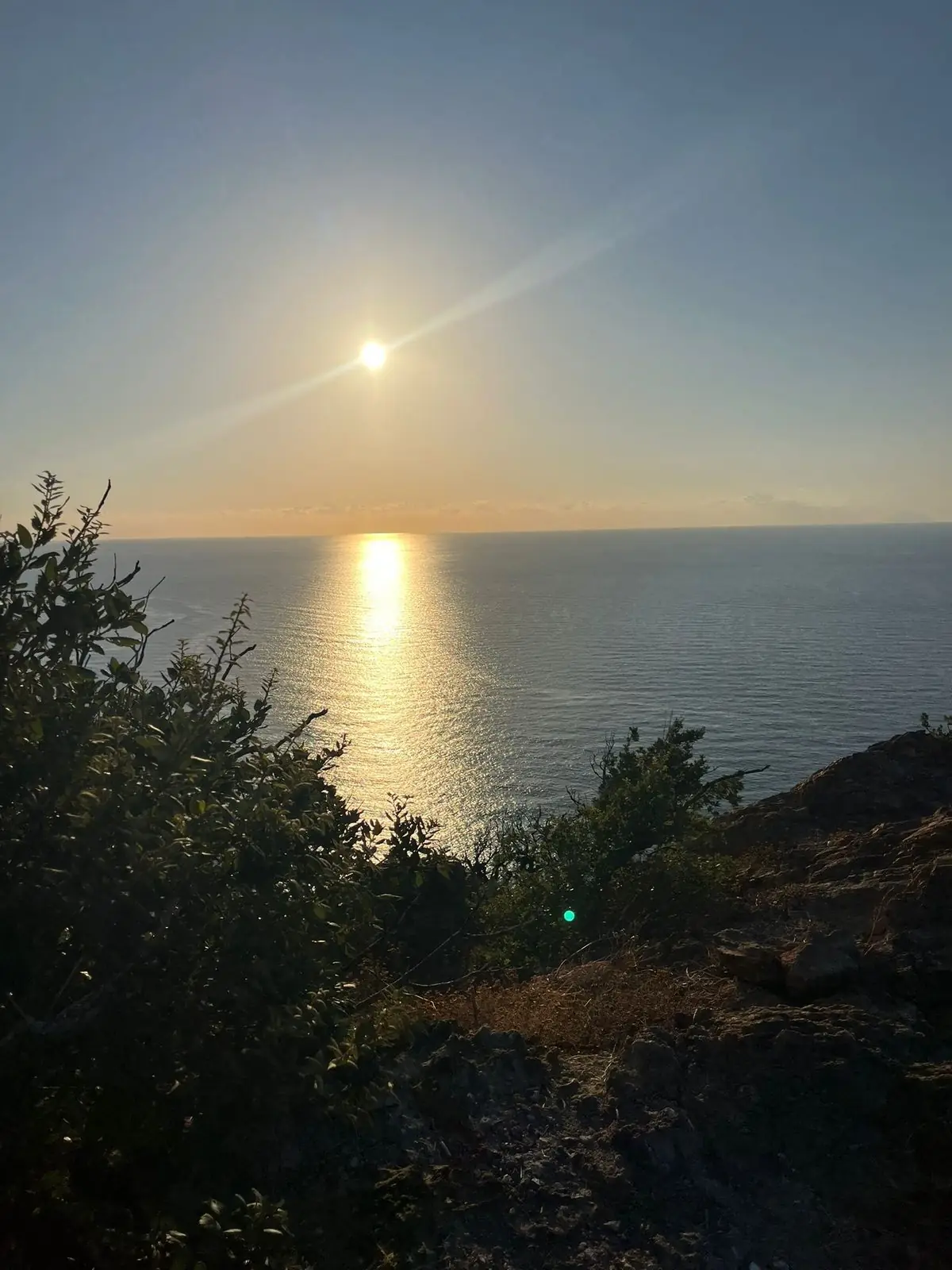 Il sole che cala sul mare, visto dal crinale di Capo Calavà